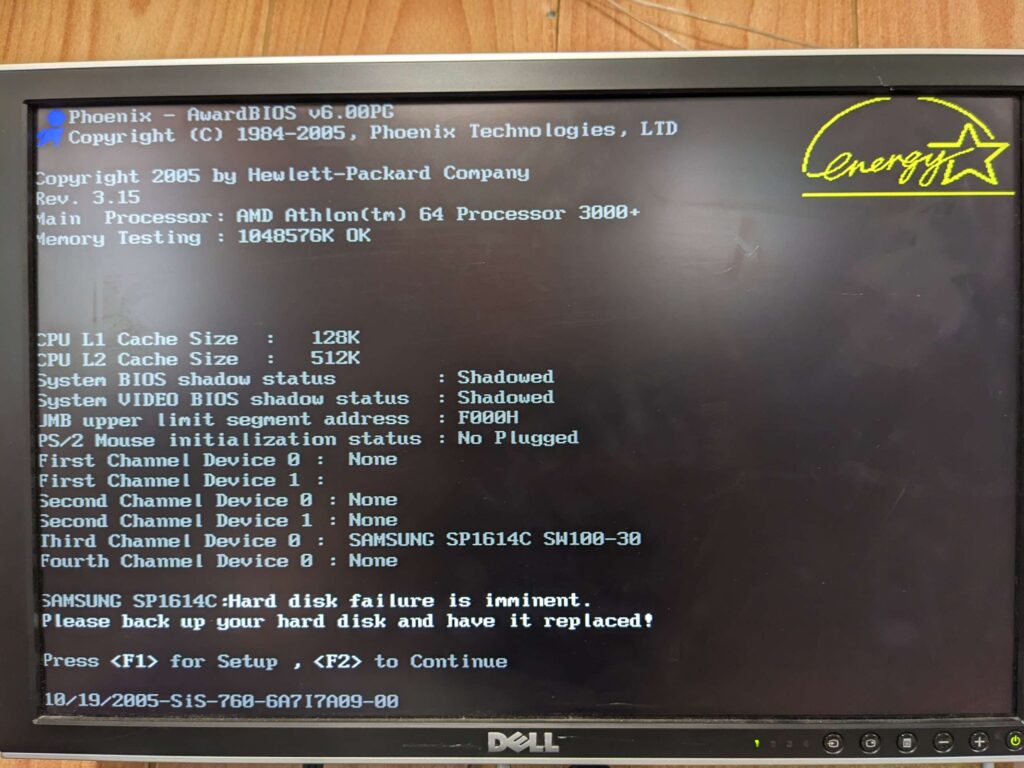 BIOS screen showing "Hard disk failure is imminent. Please back up your hard disk and have it replaced!"